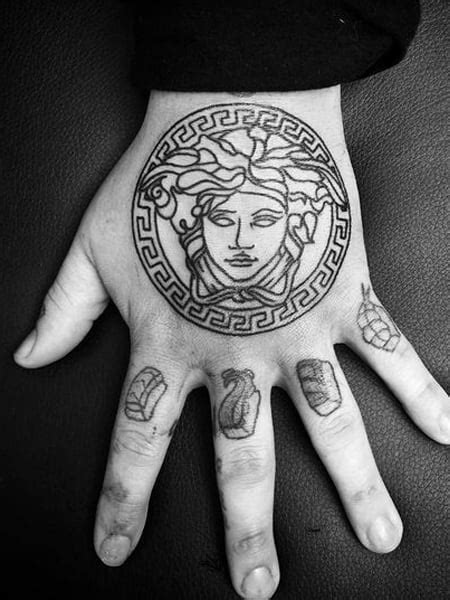 versace tattoo on hand|medusa tattoo meaning for female.